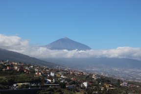 Image of mountain peak with clouds and valley below